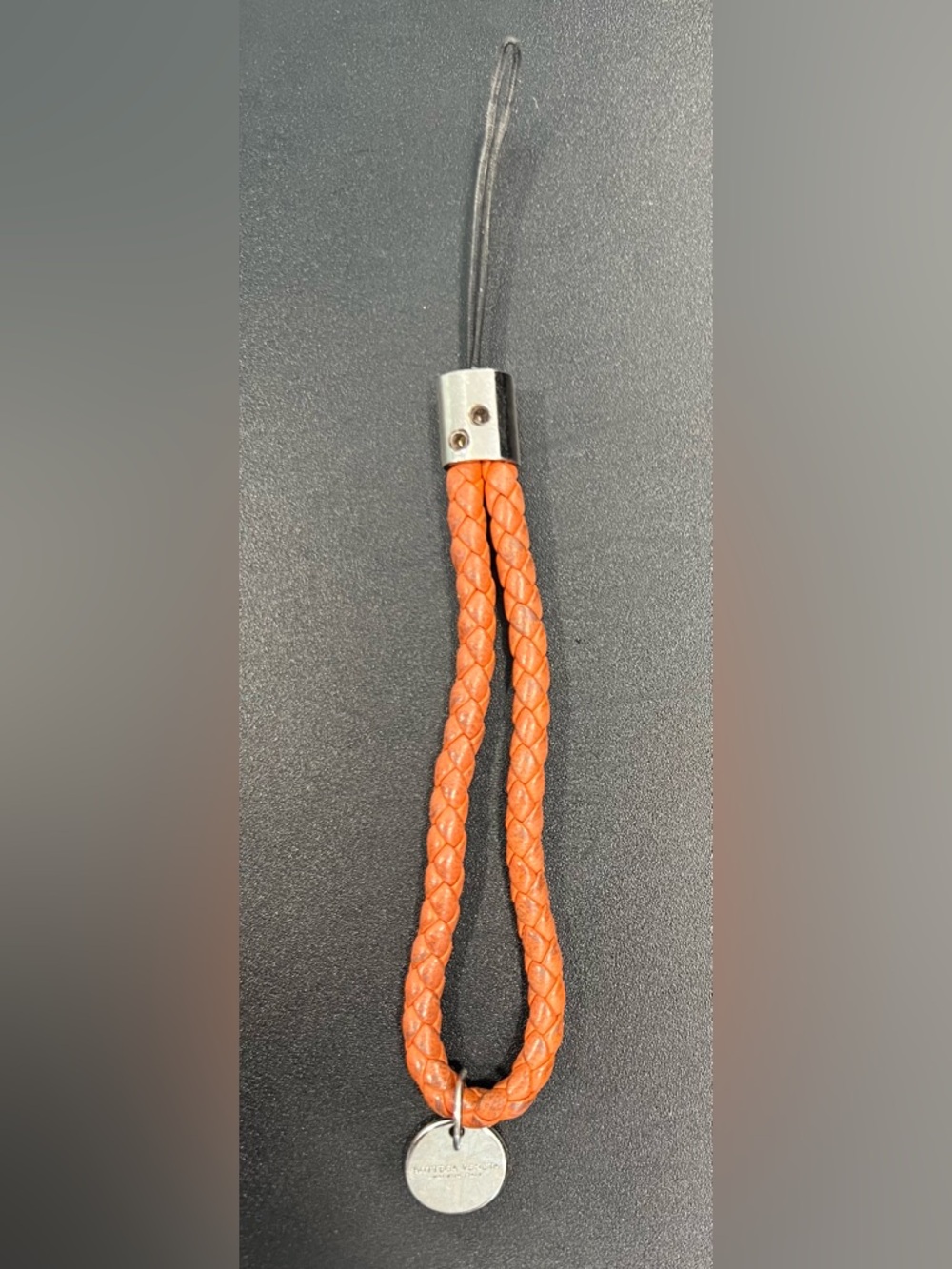 Bottega Veneta Braided Orange Leather Phone Strap with Round Silver Tag